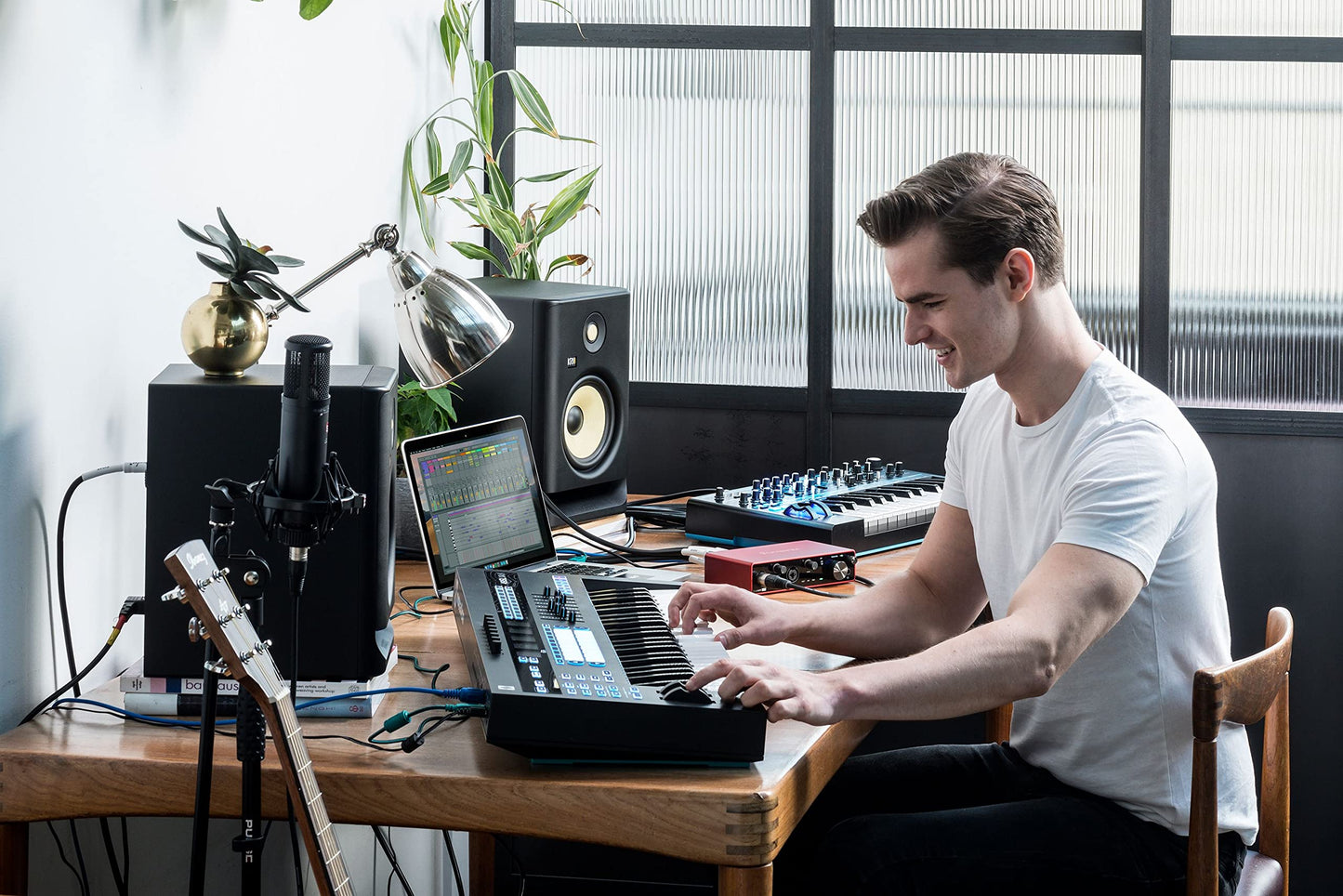 Focusrite Scarlett 4i4 USB-C studio bundle, CR3-X monitors, mic, headphones, boom stand, pop filter, cables, software.
